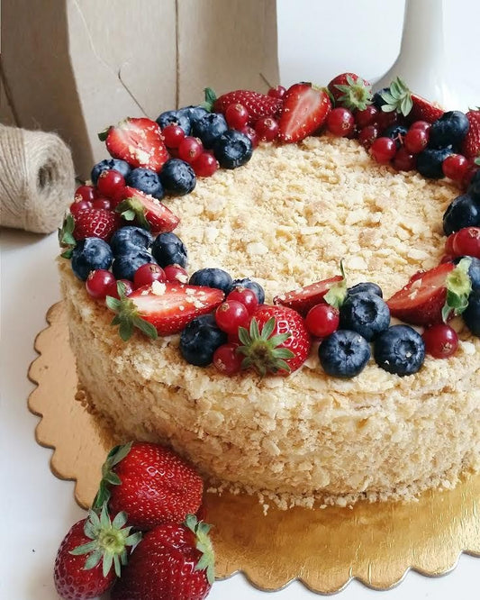Napoleon cake decorated with seasonal berries.