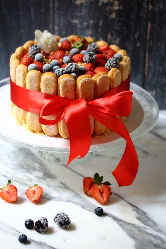 Tiramisu cake decorated with seasonal berries