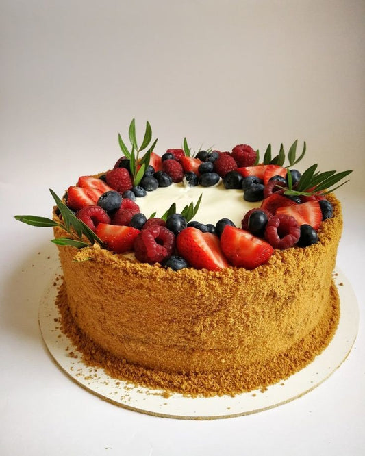 Honey cake decorated with seasonal berries. Diameter 20 cm.